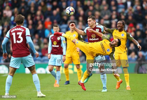 Biram Kayal of Brighton and Hove Albion is challenged Sam Vokes of Burnley during the Premier League match between Burnley and Brighton and Hove...