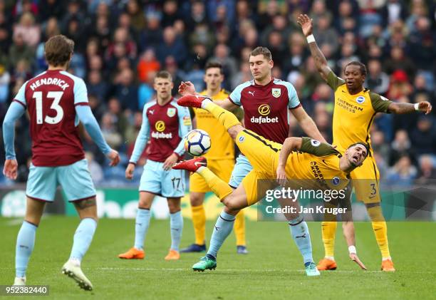 Biram Kayal of Brighton and Hove Albion is challenged Sam Vokes of Burnley during the Premier League match between Burnley and Brighton and Hove...