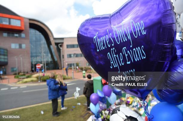 Tributes for terminally-ill British toddler Alfie Evans who died on Saturday are left outside the Alder Hey Children's hospital in Liverpool, north...