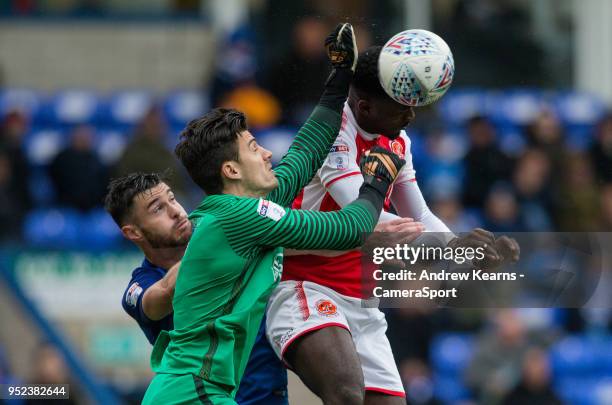 Fleetwood Town's Jordy Hiwula competing with Peterborough United's goalkeeper Jonathan Bond during the Sky Bet League One match between Peterborough...