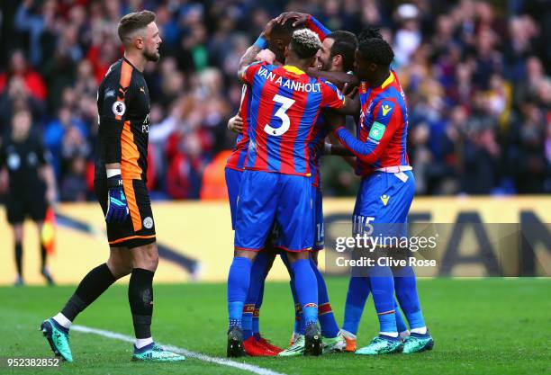 Christian Benteke of Crystal Palace celebrates with teammates after scoring his sides fifth goal during the Premier League match between Crystal...