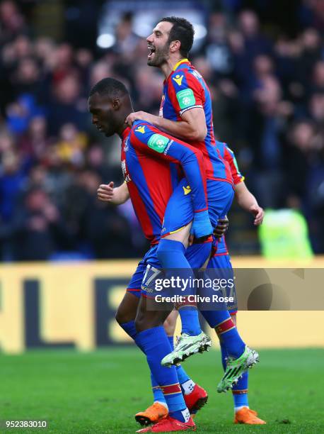 Christian Benteke of Crystal Palace celebrates with James Tomkins of Crystal Palace after scoring his sides fifth goal during the Premier League...