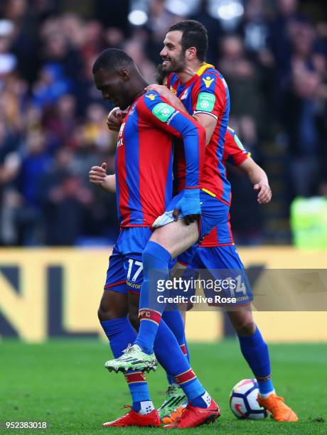 Christian Benteke of Crystal Palace celebrates with James Tomkins of Crystal Palace after scoring his sides fifth goal during the Premier League...