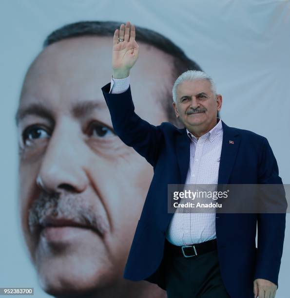 Turkish Prime Minister Binali Yildirim greets the crowd after attending AK Party's 6th ordinary provincial congress in western Izmir province, Turkey...