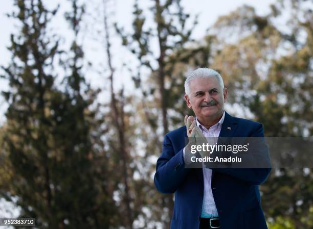 Turkish Prime Minister Binali Yildirim greets the crowd after attending AK Party's 6th ordinary provincial congress in western Izmir province, Turkey...