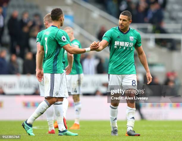 Kieran Gibbs of West Bromwich Albion shakes hands with Jake Livermore of West Bromwich Albion during the Premier League match between Newcastle...