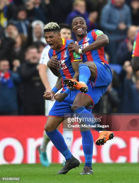 Patrick van Aanholt of Crystal Palace celebrates with Wilfried Zaha after scoring his sides fourth goal during the Premier League match between...