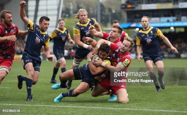 Jackson Willison of Worcester Warriors dives over for a try despite being held by Charlie Walker during the Aviva Premiership match between Worcester...