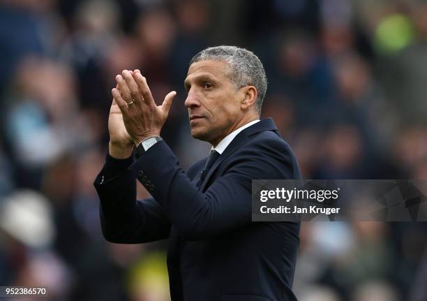 Chris Hughton, Manager of Brighton and Hove Albion applauds the travellings fans after the Premier League match between Burnley and Brighton and Hove...