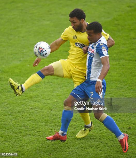 Andy Barcham of AFC Wimbledon battles with Nathan Byrne of Wigan Athletic during the Sky Bet League One match between Wigan Athletic and A.F.C....