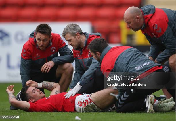 Lewis Page of Charlton Athletic receives treatment after being injured during the Sky Bet League One match between Charlton Athletic and Blackburn...