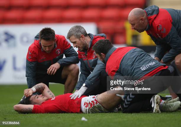 Lewis Page of Charlton Athletic receives treatment after being injured during the Sky Bet League One match between Charlton Athletic and Blackburn...