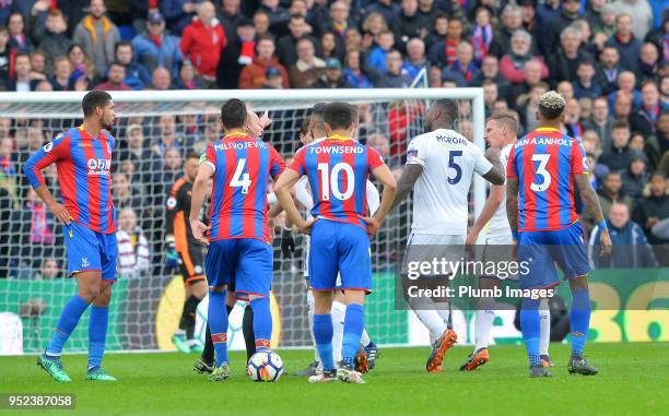 Referee Mike Dean sends off Marc Albrighton of Leicester City during the Premier League match between Crystal Palace and Leicester City at Selhurst...