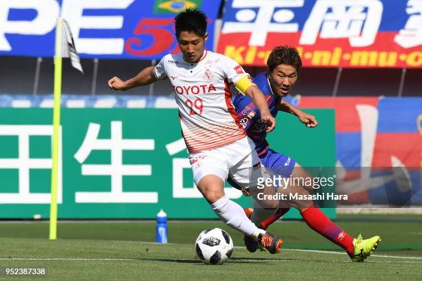 Kensuke Nagai of FC Tokyo and Ryuji Izumi of Nagoya Grampus compete for the ball during the J.League J1 match between FC Tokyo and Nagoya Grampus at...