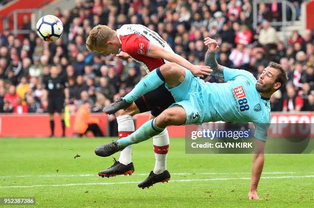 Southampton's English midfielder James Ward-Prowse vies with Bournemouth's English defender Steve Cook during the English Premier League football...