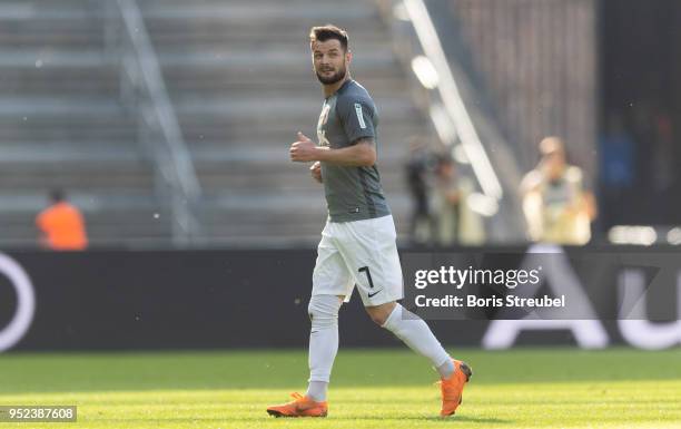 Marcel Heller of FC Augsburg leaves the pitch after receiving a red card during the Bundesliga match between Hertha BSC and FC Augsburg at...