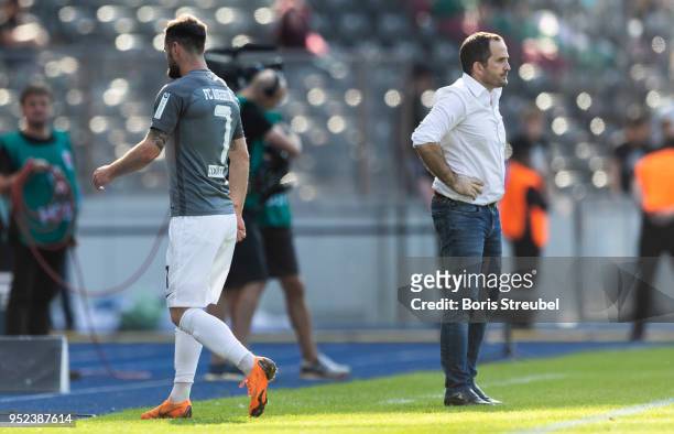 Marcel Heller of FC Augsburg leaves the pitch after receiving a red card during the Bundesliga match between Hertha BSC and FC Augsburg at...