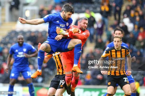 Allan McGregor of Hull City punches as Callum Paterson of Cardiff City heads the ball during the Sky Bet Championship match between Hull City and...