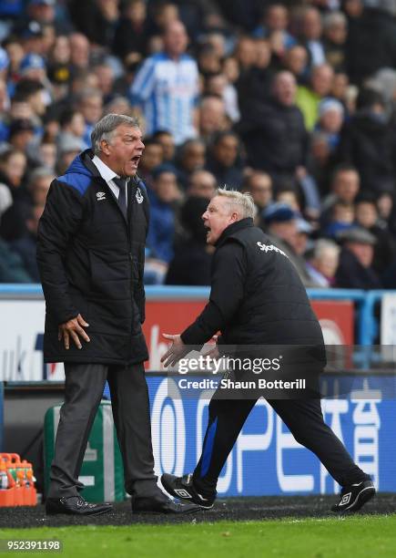 Sam Allardyce, Manager of Everton and Assistant Manager Sammy Lee react during the Premier League match between Huddersfield Town and Everton at John...