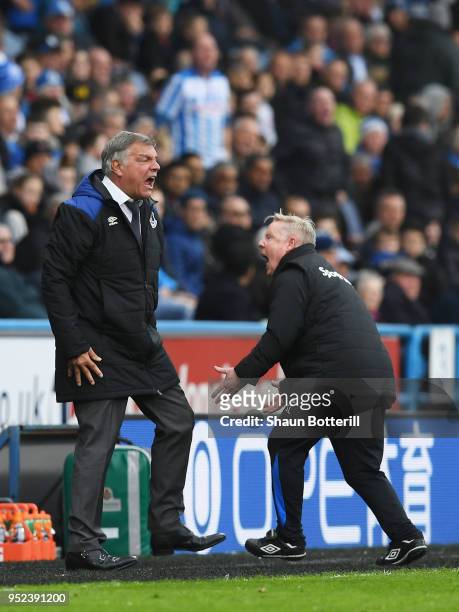 Sam Allardyce, Manager of Everton and Assistant Manager Sammy Lee react during the Premier League match between Huddersfield Town and Everton at John...