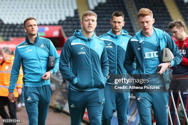 Andy King, Alfie Mawson, Kristoffer Nordfeldt and Sam Clucas of Swansea City arrives at the Liberty Stadium ahead of kick off of the Premier League...