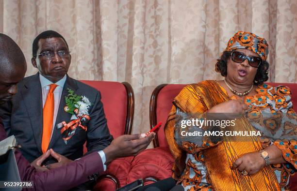 Malawi's former president Joyce Banda , flanked by her husband and Malawi's former minister of Justice, Richard Banda , speaks to journalists on...