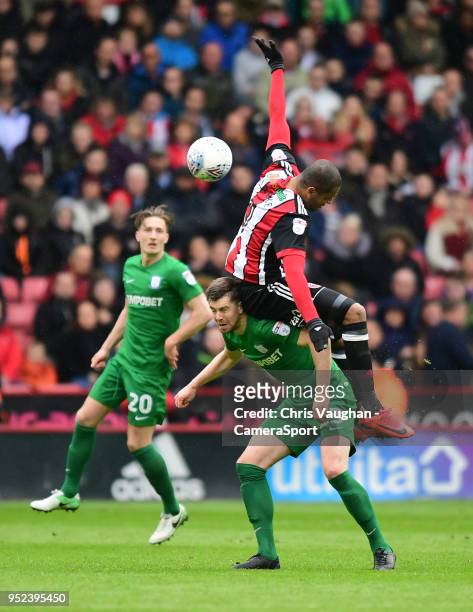 Preston North End's Paul Huntington vies for possession with Sheffield United's Leon Clarke during the Sky Bet Championship match between Sheffield...