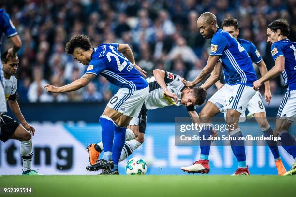 Thilo Kehrer of Schalke, Thorgan Hazard of Moenchengladbach, Naldo and Leon Goretzka of Schalke in action during the Bundesliga match between FC...