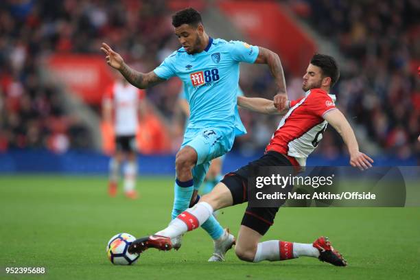 Joshua King of AFC Bournemouth in action with Wesley Hoedt of Southampton during the Premier League match between Southampton and AFC Bournemouth at...