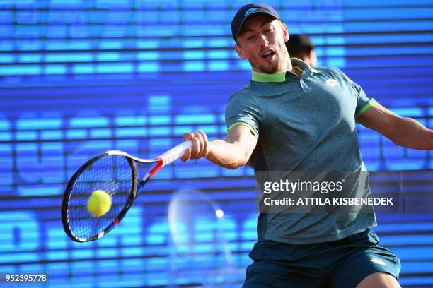 Australian John Millman returns the ball to Slovenian Aljaz Bedene during their ATP semifinal tennis match at the Hungarian Open in Budapest, on...