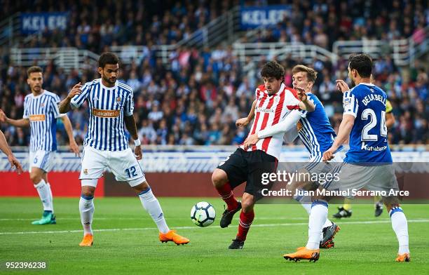 Mikel San Jose of Athletic Club competes for the ball with Diego Llorente of Real Sociedad during the La Liga match between Real Sociedad and...