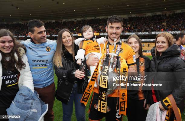 Ruben Neves of Wolverhampton Wanderers poses with the Sky Bet Championship trophy after the Sky Bet Championship match between Wolverhampton...