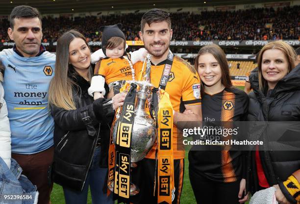 Ruben Neves of Wolverhampton Wanderers poses with the Sky Bet Championship trophy after the Sky Bet Championship match between Wolverhampton...