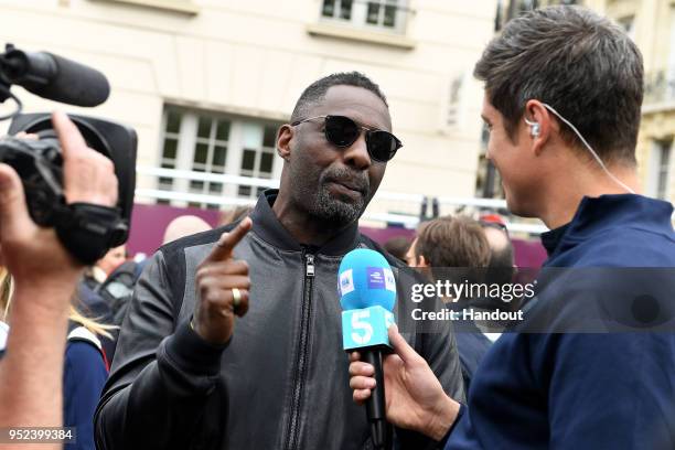 In this handout provided by FIA Formula E, Actor Idris Elba talking to TV Presenter Vernon Kaye. During the Paris E-Prix in the Paris ePrix, Round 8...