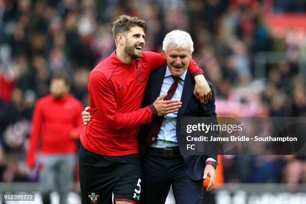 To R Jack Stephens and Mark Hughes of Southampton celebrate after the final whistle is blown during the Premier League match between Southampton and...