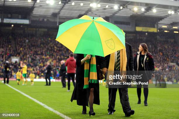 Norwich City Majority Shareholder Delia Smith walks off the pitch carrying an umbrella during the Sky Bet Championship match between Norwich City and...
