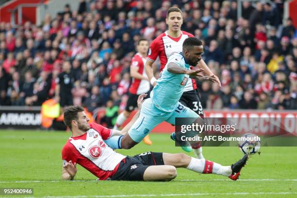 Wesley Hoedt of Southampton clears from Jermain Defoe of Bournemouth during the Premier League match between Southampton and AFC Bournemouth at St...