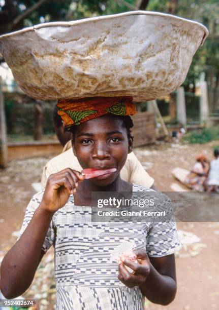 African girl with ice cream Yaounde, Cameroon.