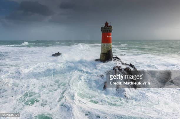 aerial view of the storm in brittany with huge waves on lighthouse - ouessant photos et images de collection