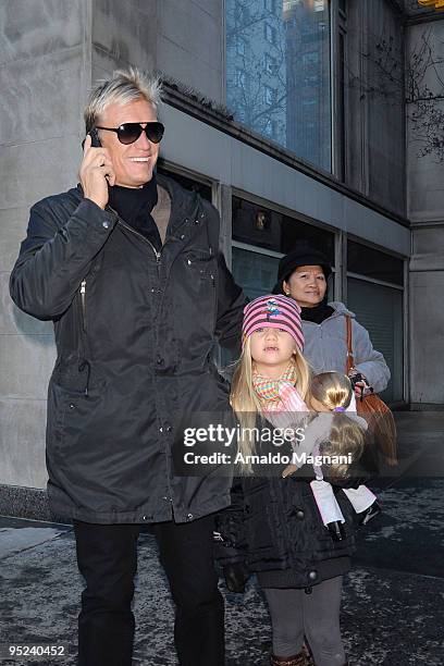 Actor Dolph Lundgren and his daughter Greta Eveline Lundgren walk on Madison Avenue December 24, 2009 in New York City.