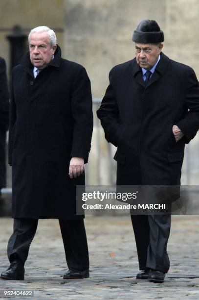 Pierre and Charles Pasqua arrive for the funeral of French politician, Philippe Seguin, at the Saint-Louis-des-Invalides Church in Paris.