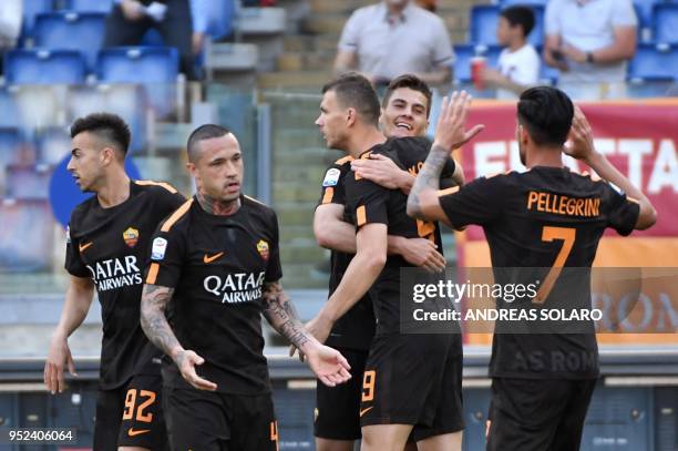 Roma's Czech striker Patrik Schick celebrates with his team mates after scoring during the Italian Serie A football match Roma vs Chievo, on April...