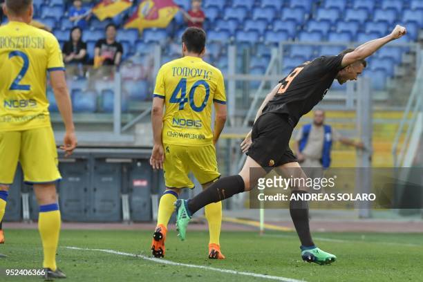 Roma's Bosnian striker Edin Dzeko celebrates after scoring during the Italian Serie A football match Roma vs Chievo, on April 28, 2018 at Rome's...
