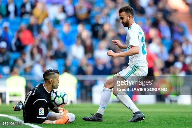 Leganes' Spanish goalkeeper Pichu Cuellar blocks a shot on goal by Real Madrid's Spanish forward Borja Mayoral during the Spanish League football...