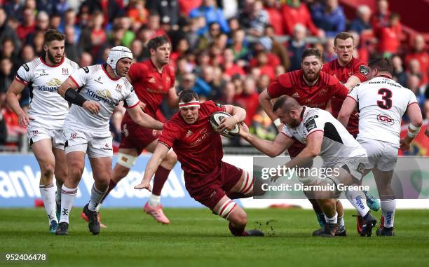 Limerick , Ireland - 28 April 2018; Robin Copeland of Munster is tackled by Rory Best, left, and Alan OConnor of Ulster during the Guinness PRO14...