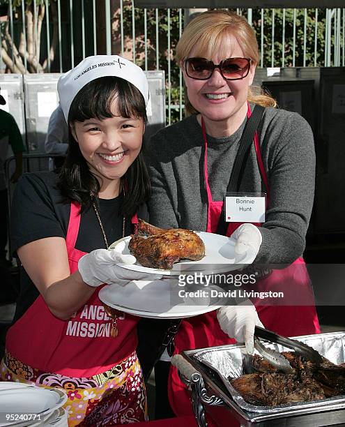 Tania Gunadi and Bonnie Hunt attend Christmas Eve at the Los Angeles Mission on December 24, 2009 in Los Angeles, California.