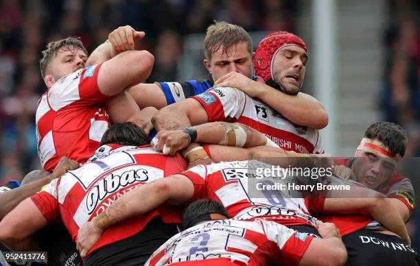 Mariano Galarza of Gloucester is grabbed by Tom Ellis of Bath during the Aviva Premiership match between Gloucester Rugby and Bath Rugby at Kingsholm...