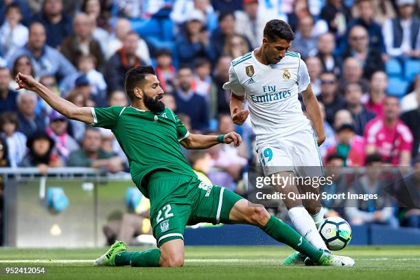 Achraf Hakimi of Real Madrid competes for the ball with Dimitrios Siovas of Leganes during the La Liga match between Real Madrid and Leganes at...