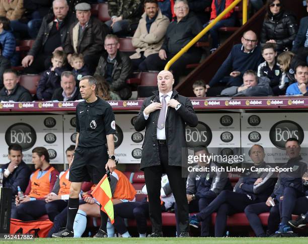 Burnley manager Sean Dyche shouts instructions to his team from his technical area during the Premier League match between Burnley and Brighton and...