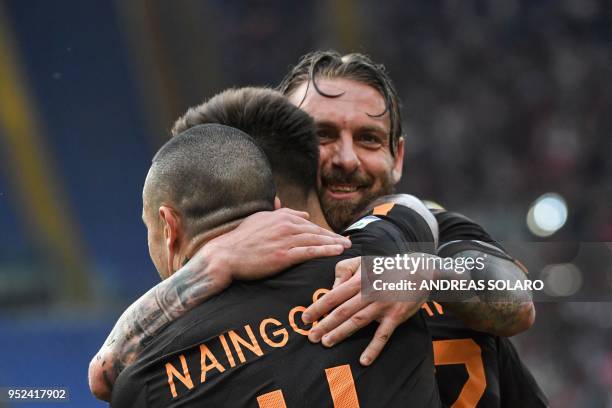 Roma's Italian striker Stephan El Shaarawy celebrates with teammates after scoring a goal during the Italian Serie A football match between Roma and...